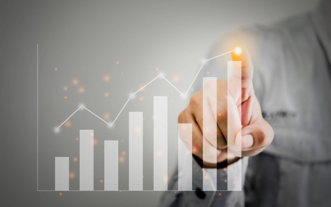 Grey image of a finger tracing a growth line on a digital bar chart, symbolising data analysis and tracking progress in performance metrics -analysing pitfalls in value realisation