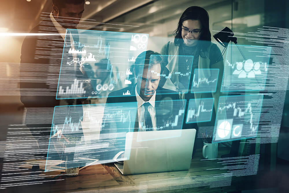 Team of professionals looking at a large screen displaying charts and graphs related to value management, collaborating on strategies and data analysis