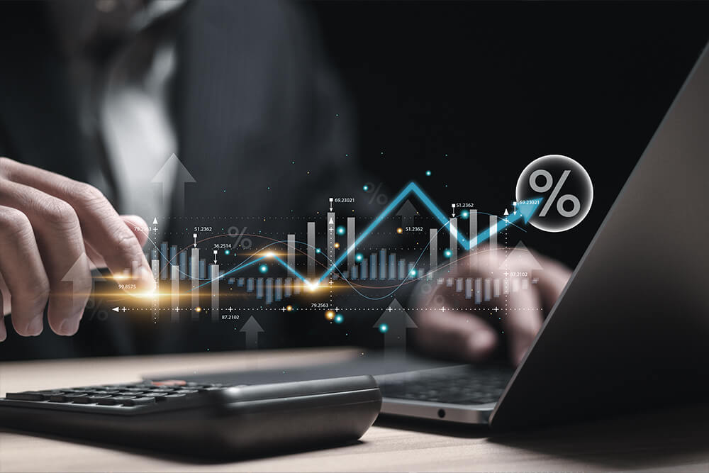 Hand and digital chart focused on value realisation office, featuring a professional engaged in analysis and strategy discussions